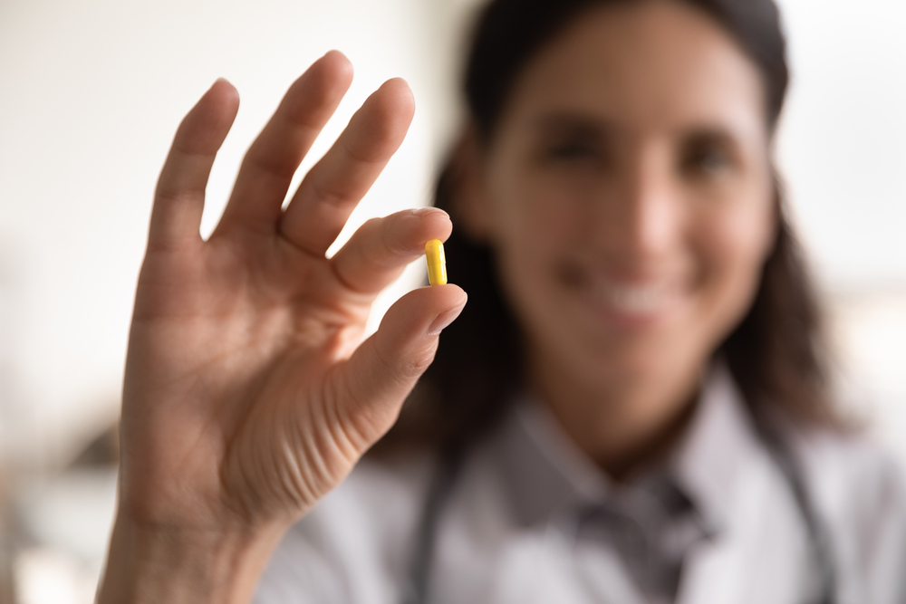 Pharmacological,therapy.,close,up,portrait,of,smiling,female,doctor,scientist