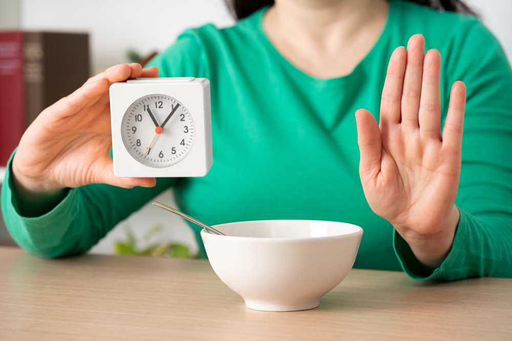 Woman,hands,on,intermittent,fasting,doing,stop,sign,at,home