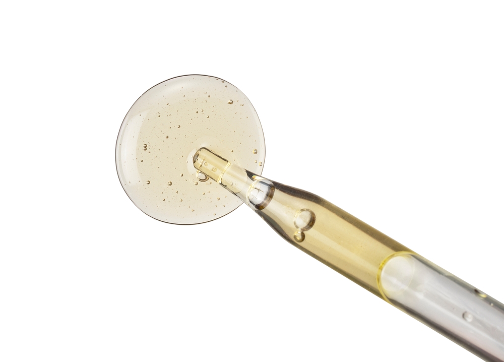 Clear,yellow,liquid,gel,or,serum,on,white,background.,beauty