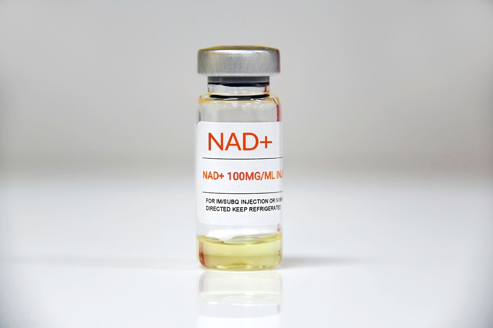 A,single,vial,of,nad,+,on,white,background.