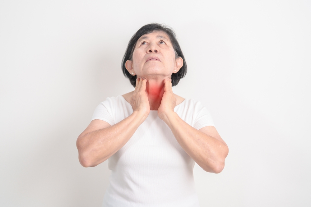 Elderly,Woman,Checking,Thyroid,Gland,Disease.,Hand,Holding,Neck,Pain