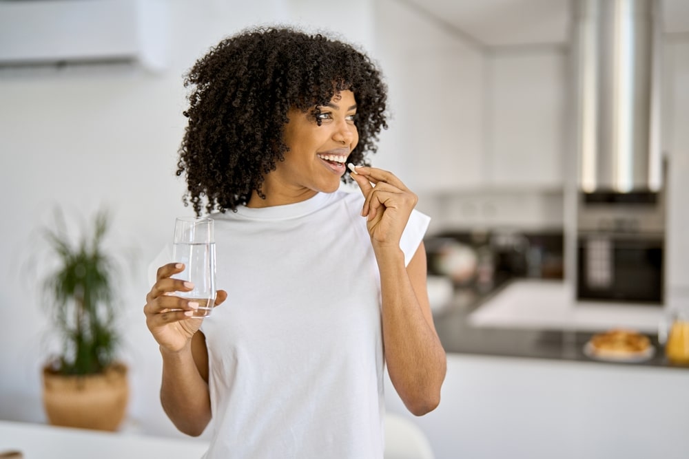 Happy,healthy,young,adult,african,american,woman,model,talking,pill