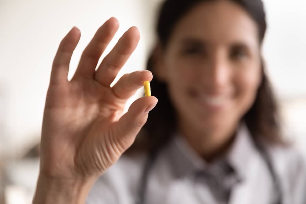Pharmacological,therapy.,close,up,portrait,of,smiling,female,doctor,scientist