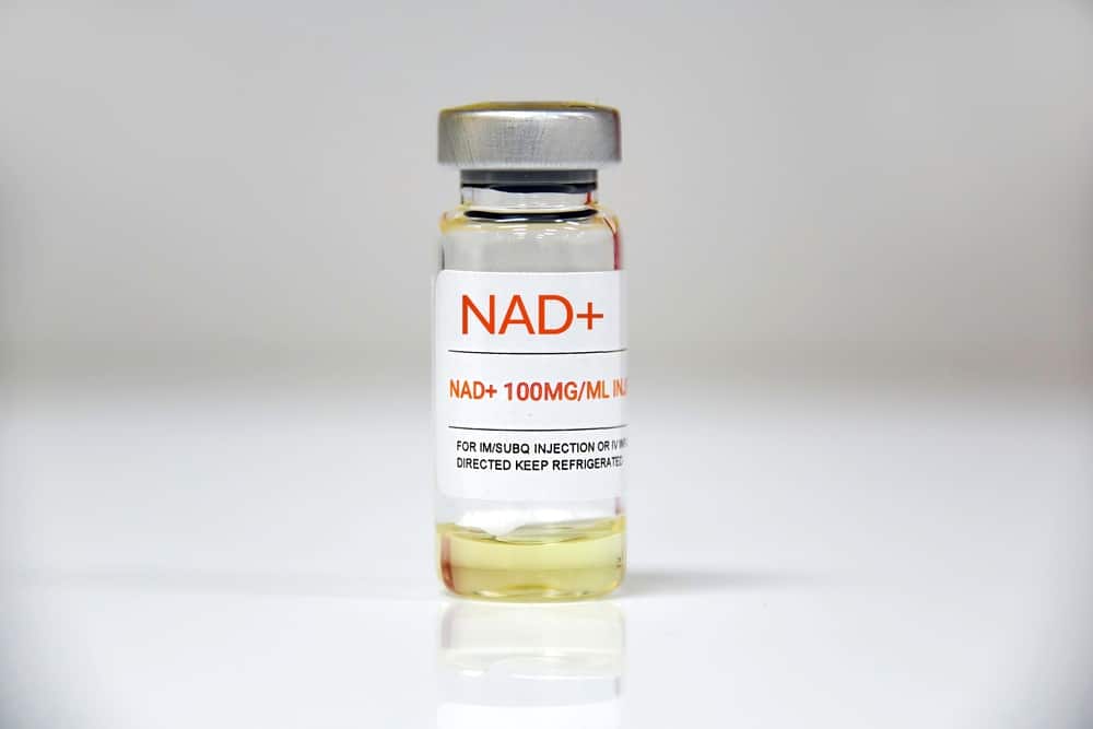 A,single,vial,of,nad,+,on,white,background.