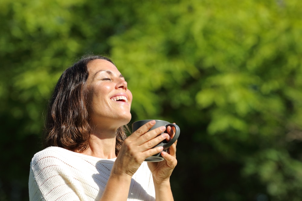 Satisfied,Adult,Woman,Breathing,Fresh,Air,Holding,A,Coffee,Cup Vitamin D3 in Sandy, UT