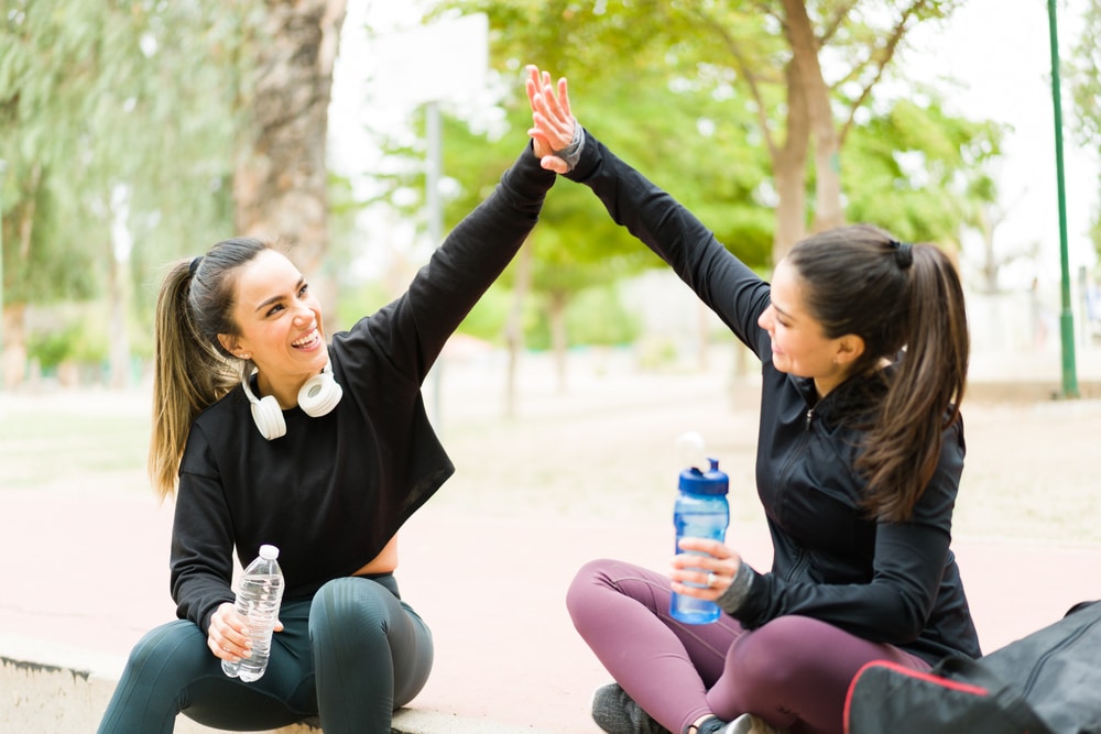 Excited,Fit,Young,Women,In,Sportswear,Doing,A,High,Five Lipo B/MICC in Sandy, UT