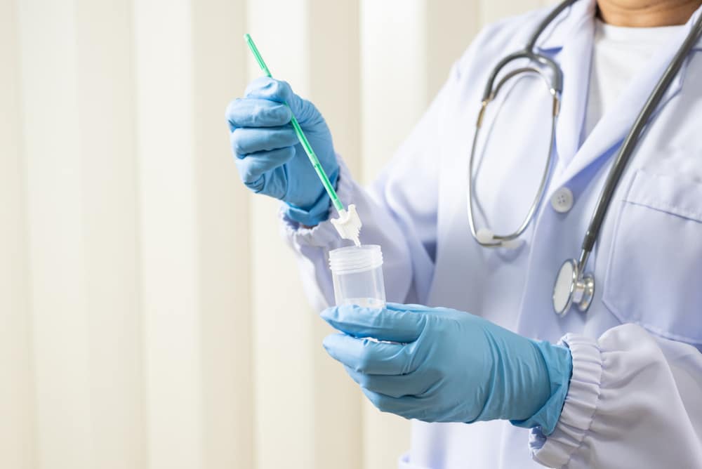 Doctor,Hand,Holding,Liquid,Base,Cytology,Set,On,Blue,Background.gynecologist Lab Services in Sandy, UT